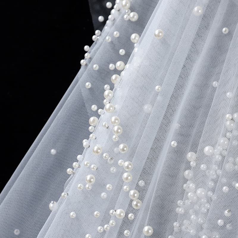 The Bridal Gown Features Round Pearl Embellishments Exuding A Vintage High-end Elegance